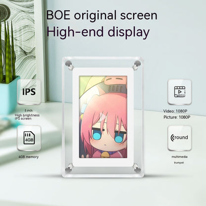 A digital photo frame featuring a BOE original high-end screen with a clear acrylic design displayed against a backdrop of a light patterned surface and plant. The frame boasts a 5-inch high brightness IPS screen and 4GB memory, indicating its multimedia capabilities with support for 1080P video and picture quality. An illustrated character with pink hair is shown on the display, symbolizing the frame's vibrant image rendering.