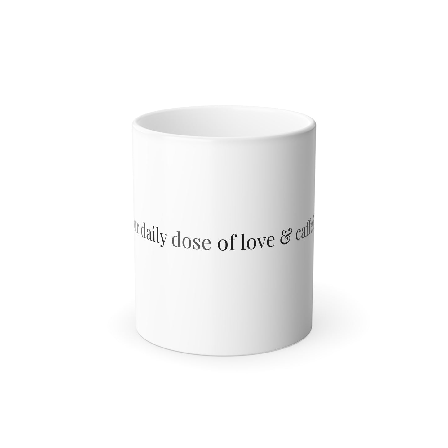 Side view of white ceramic mug with 'Your daily dose of love & caffeine' curved text design
