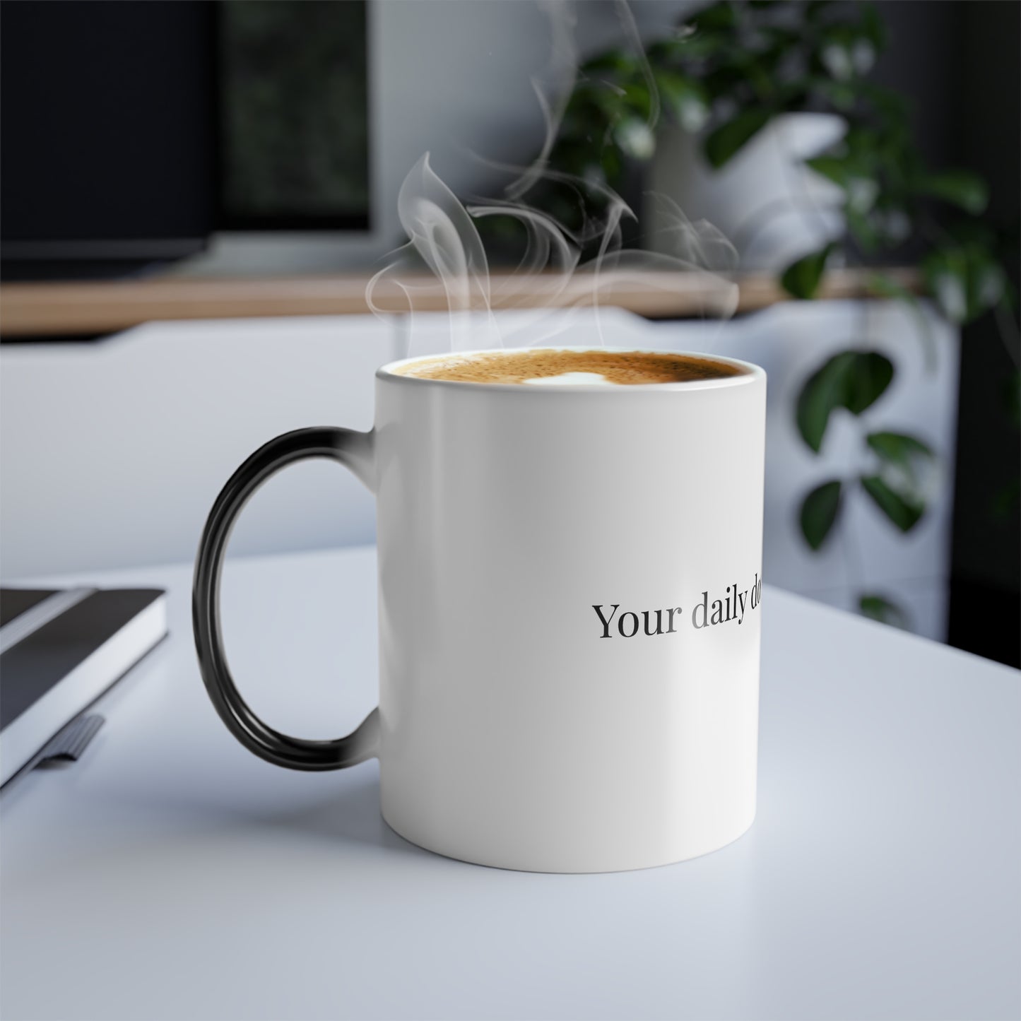 Color changing coffee mug with steam and 'Your daily dose of love & caffeine' design in cozy office setting