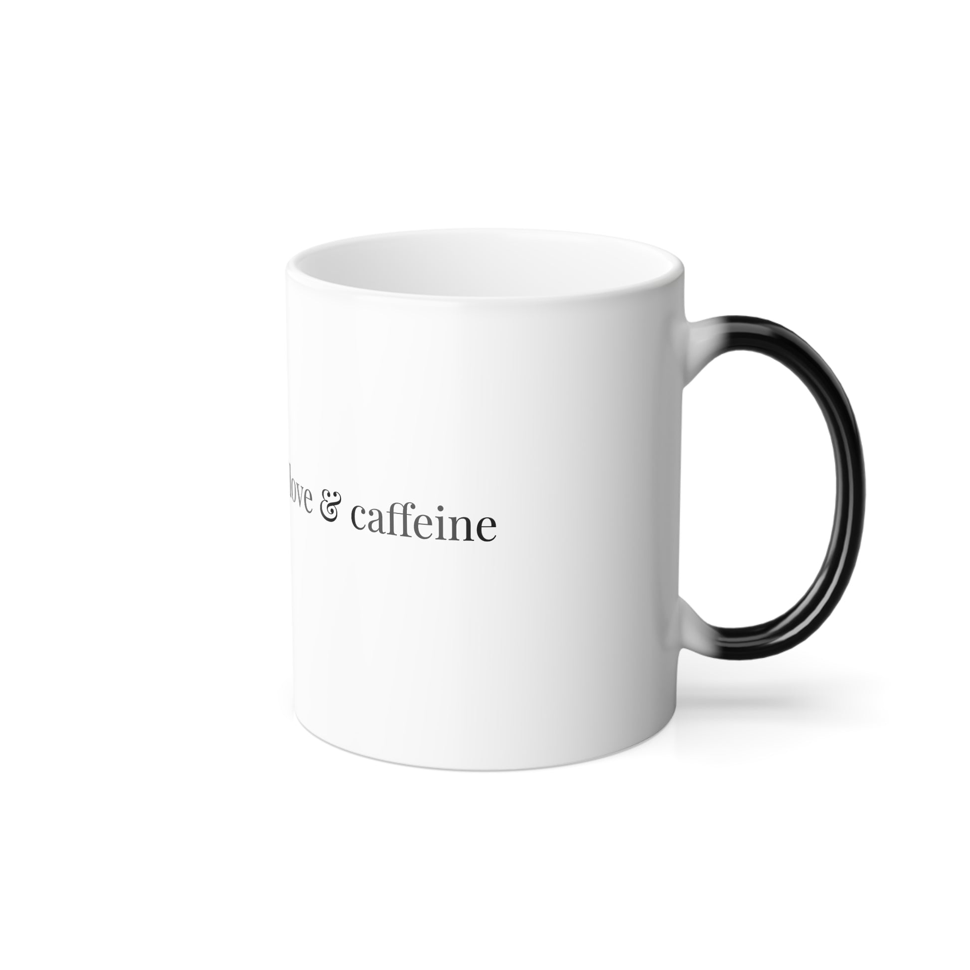 White ceramic mug with black handle and 'Your daily dose of love & caffeine' text